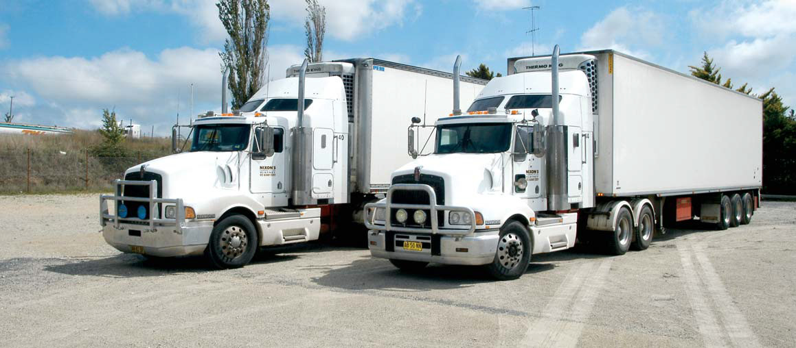 Two of Nixon's Transport Kenworth T404 trucks.